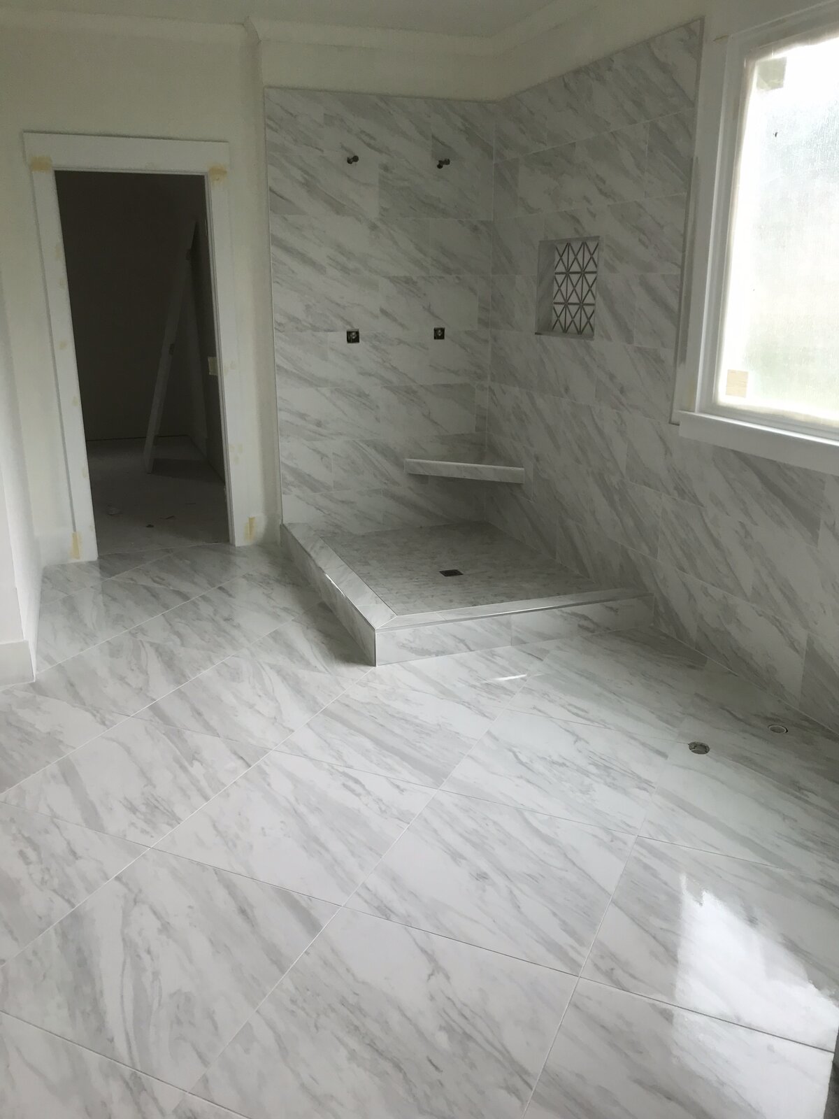 Bathroom tile floor and walls by Peter's Tile