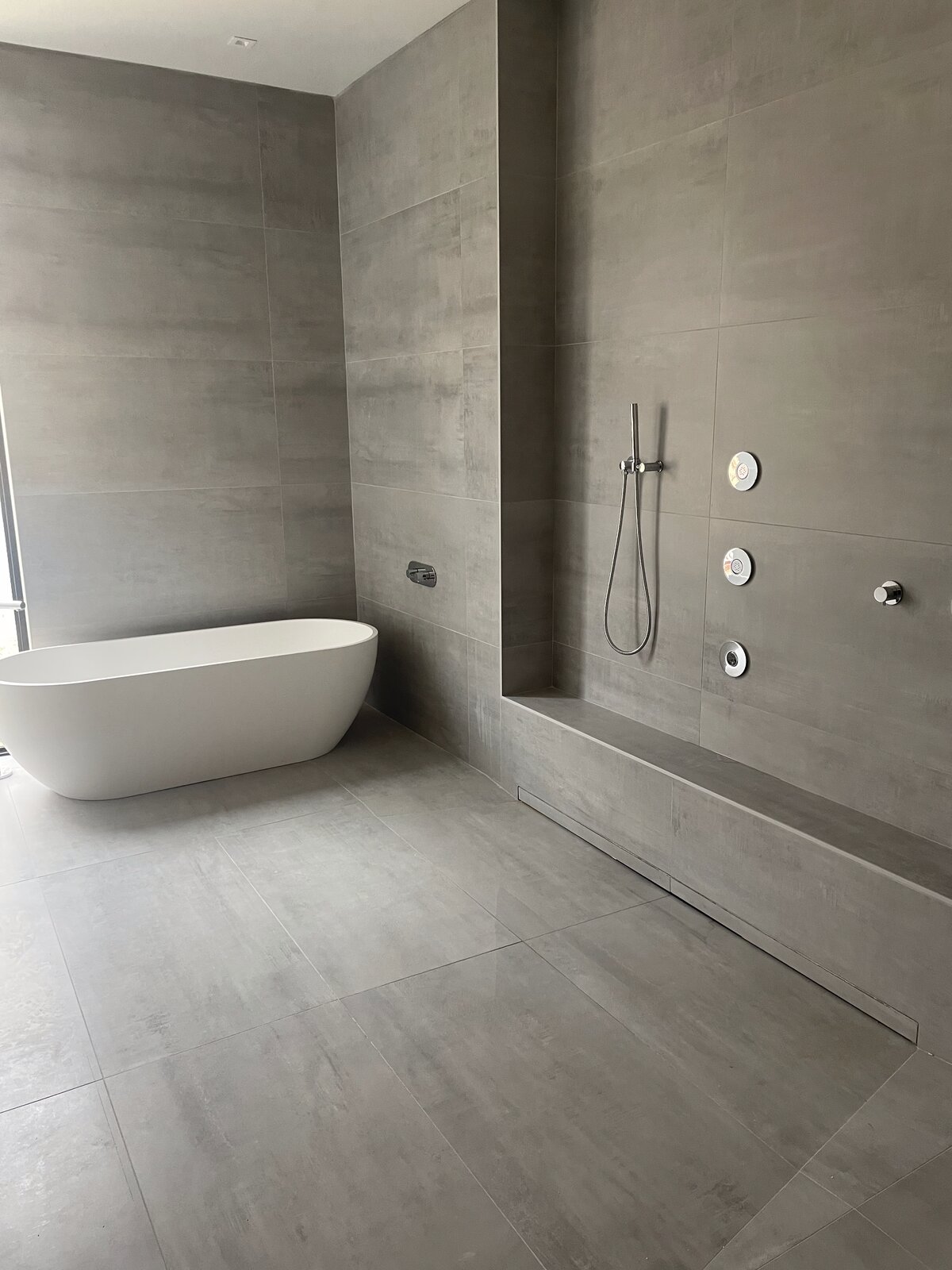 Bathroom tile floor and walls by Peter's Tile