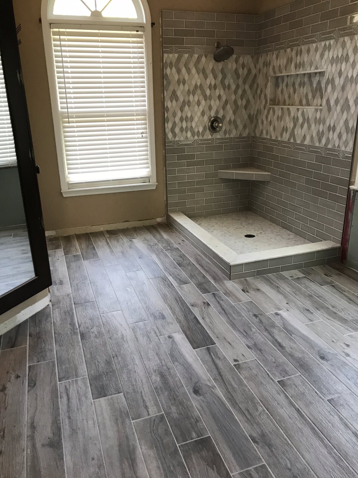 Bathroom tile floor and walls by Peter's Tile